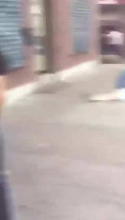 man fights naked in public