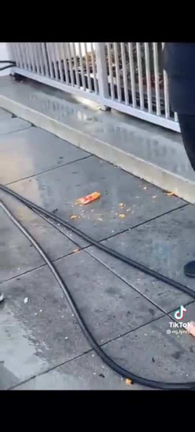 A staff member of Scientology is called out for spraying homeless people on the sidewalk with a water in Los Angeles, CA.