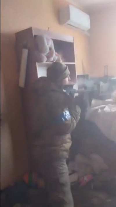 Ukrainian firing DShK from a building upper level in Bakhmut
