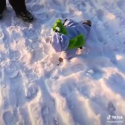 A monkey in kids winter clothing