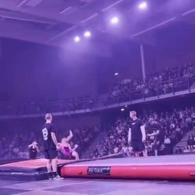Gymnast does a forward backflip