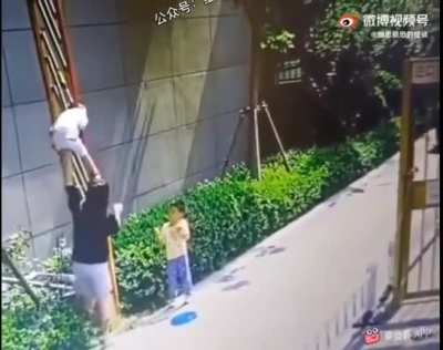 Letting the kids cross through an automatic fence boom barrier