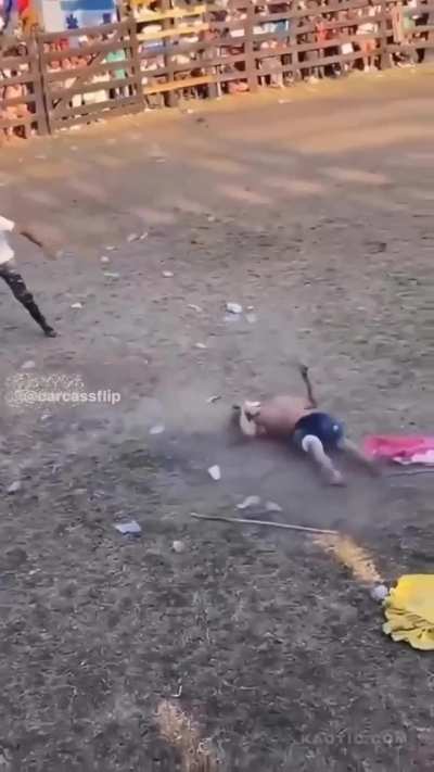 Guy tries to flip over a bull ends bad 