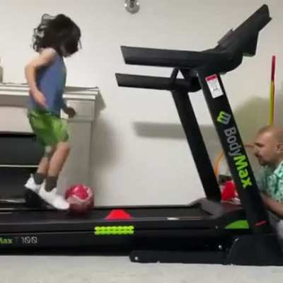 Child prodigy training on a treadmill
