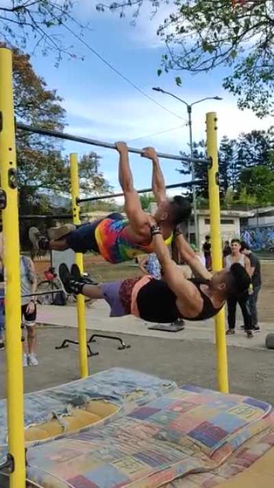 My friend and I performing a double Front Lever Walk