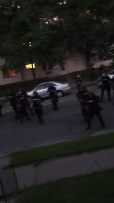 Police and National Guard patrolling neighborhood and shooting civilians on their own property.