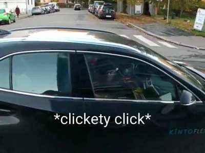 Both hands on the phone, ignores red lights