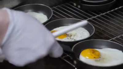 Assembly of American style Cheeseburgers in a Korean Restaurant