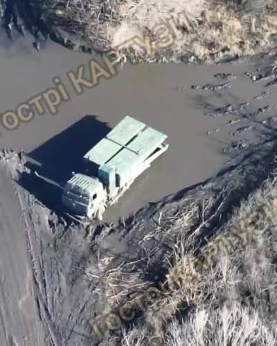 Ukrainian kamikaze drone destroys a Russian pontoon bridge vehicle likely in Luhansk Oblast. November 2023 (music from source)