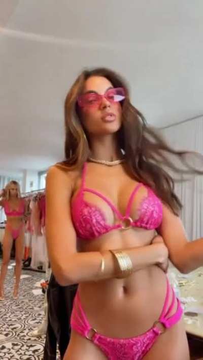 Leidy wears pink glasses
