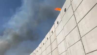 IDF soldiers trying to start fires in Lebanon using a trebuchet