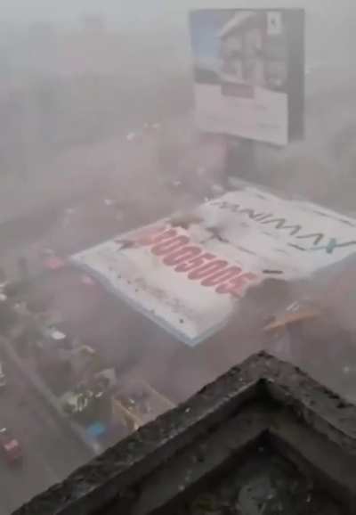 A giant billboard fell and crashed into a gas station during a storm. 