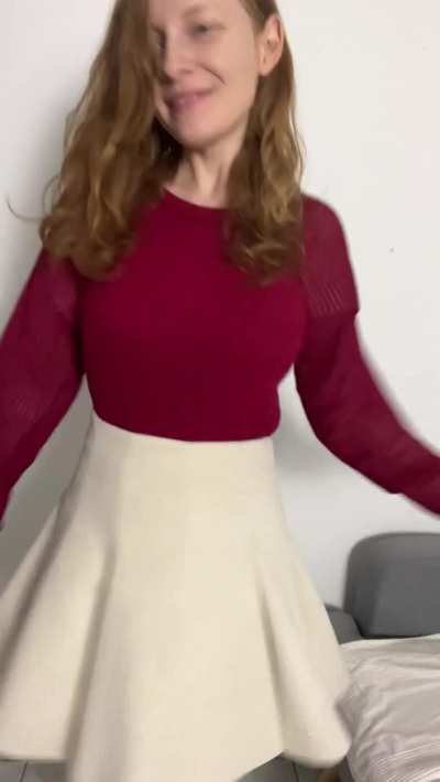A slightly dorky reveal from a busty redhead!