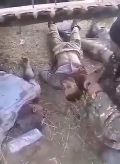 Armenian Warcrime: Armenian army proudly records itself mutilating Azerbaijani soldiers.