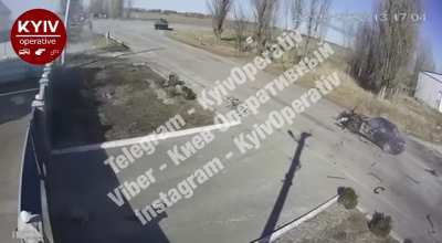 Car gets lit up by Russian tank before reaching intersection. Kyiv region, Ukraine 3/8/22