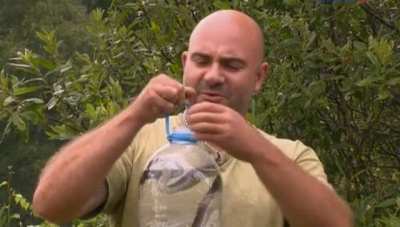 Making a fake survival video claiming snakes clean water
