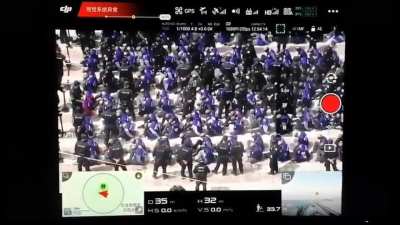 Uighurs being transported while blindfolded