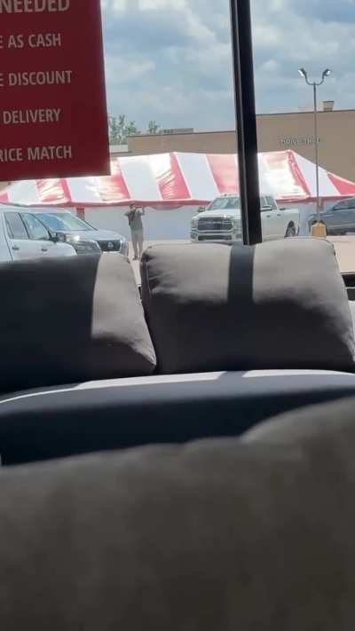 Cellphone video of Travis Posey firing his shotgun in the parking lot of the Mad Butcher grocery store during the Fordyce shooting
