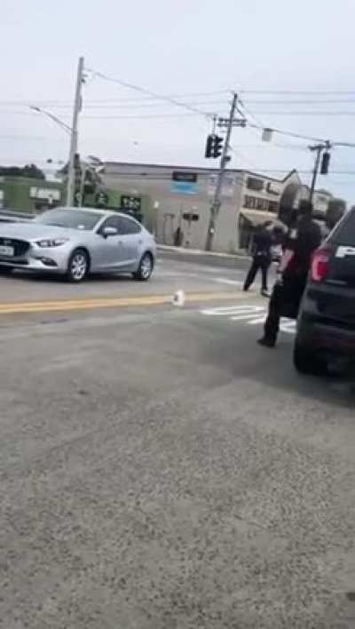 Nude black guy swinging his external organ of the reproductive system in public.