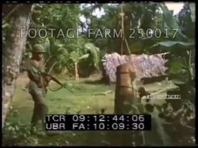 US soldiers tests a Vietcong boobytrap - Vietnam.