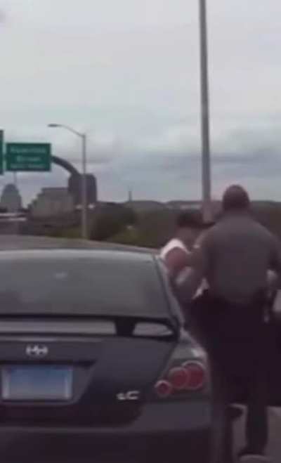 Cop loses it on the side of the highway