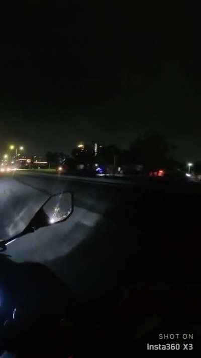 Standing in the middle of an highway.