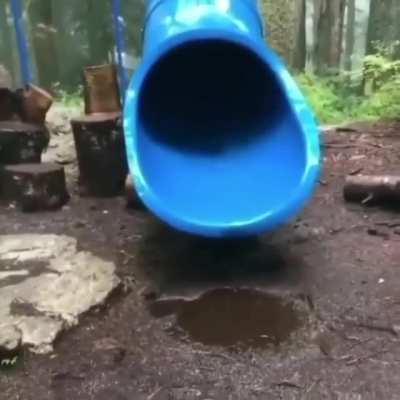 Kid starts spinning inside a slide