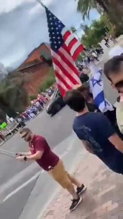 Pro-Israeli mobs and a former Israeli soldier harass a Muslim woman in the United States, hurling Islamophobic and racist slurs at her as the police stand by without intervening.