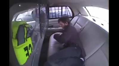 Trying to set a police car on fire