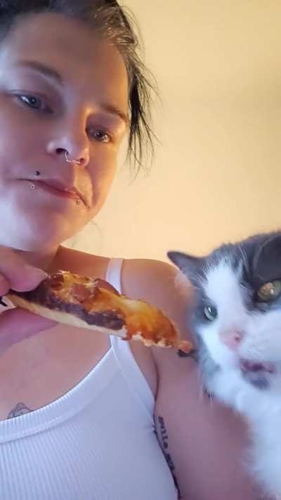 Pepper helping me with my pizza....