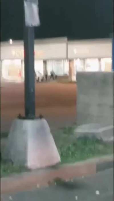Police arrive to a looted CVS, guy looting proceeds to flee, crashing and flipping a truck.
