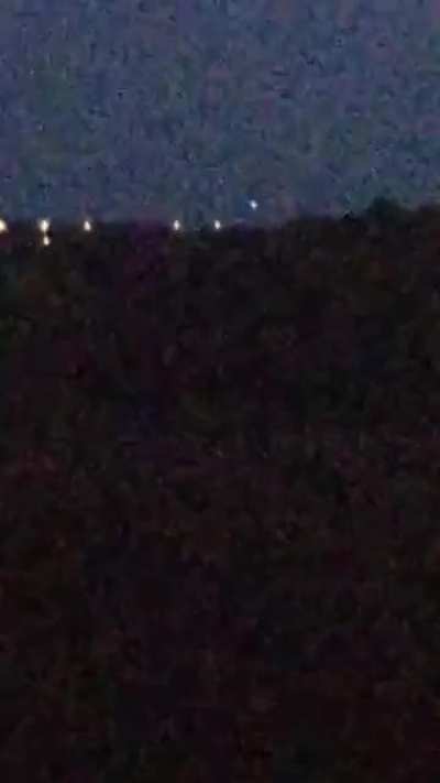15 09 20 UK 3 lights dancing about probably 4 miles off. Row of lights below are street lamps.