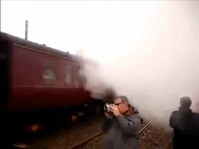 Oblivious trainspotter narrowly avoids a rather nasty 