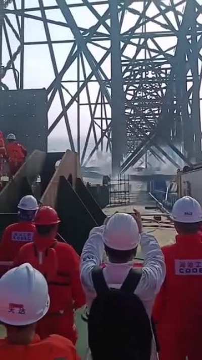 Massive foundations for offshore oil platform being deployed.