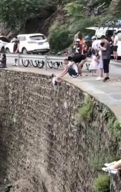 Chinese parents taking a memorable photo of their kids.