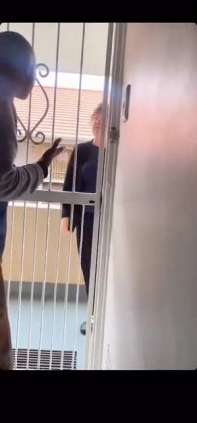 African guy calmly handles Karen neighbour