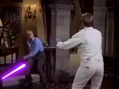 Niles Crane (David Hyde Pierce) duels a German swordsman in a scene from 