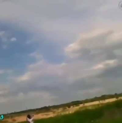 Throwing a copper wire-wrapped rock at a power line