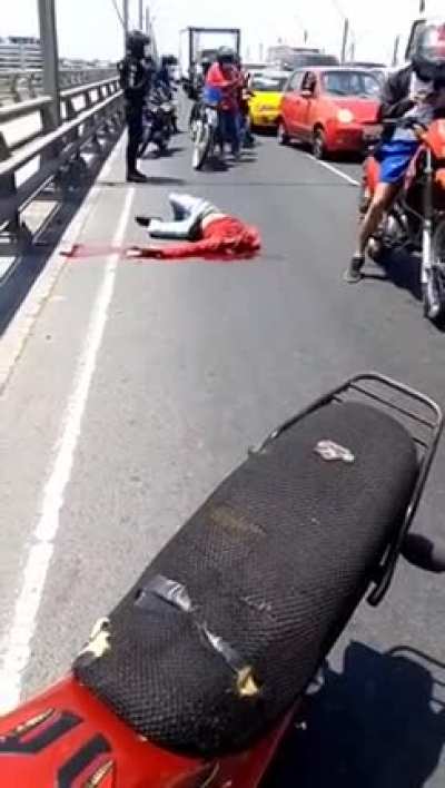 Motorcyclist looses head to street sign.