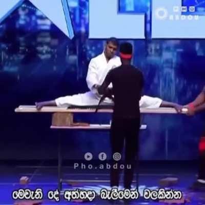 Man tries to break brick over head, it goes about as well as expected.