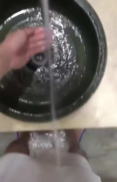 The water goes beyond the hand washing’s drain, so I can wash my feet