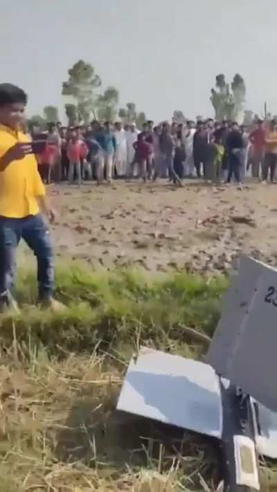 Kicking a fallen down drone. Video from Pakistan.