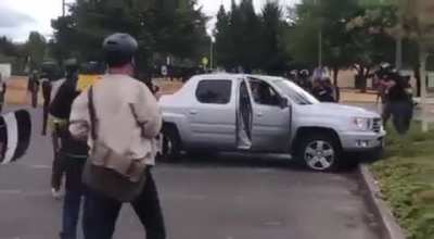 Proud Boys in Portland drag a guy out of his truck then destroy it and slash the tires