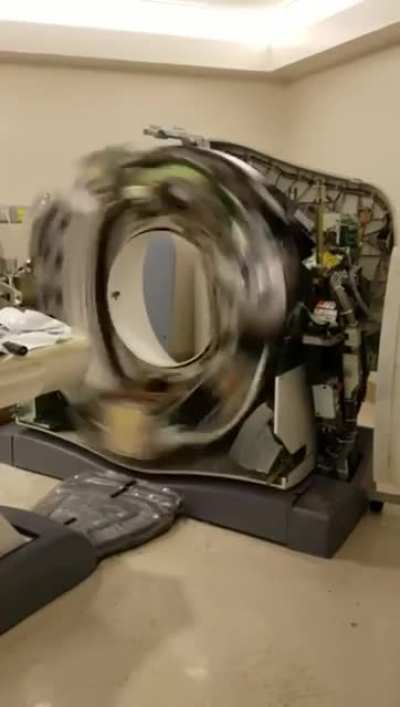 computerized tomography (CT) scan machine with the covers removed.
