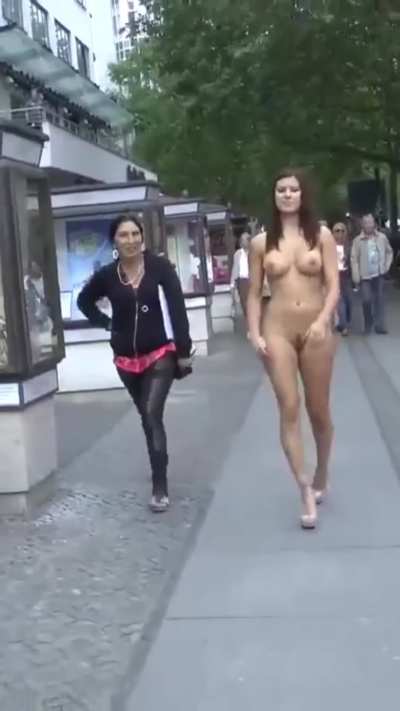 A sexy woman left only her high-heeled shoes on and went for a walk. Interesting reactions from strangers passing by.