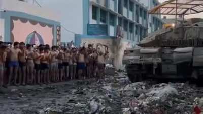 Hamas fighter mass surrendering themselves and their weapons