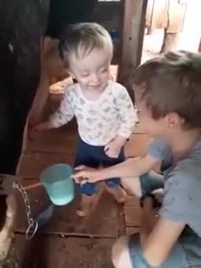 Aww brotherly love- allowing little brother to spray him . Love that laugh
