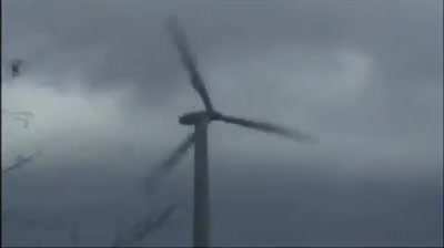 A windmill in very heavy storm.