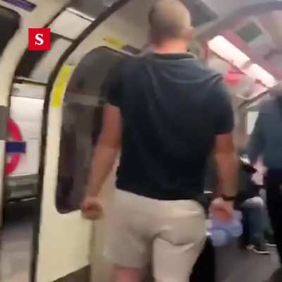 Guy gets knocked out in London Tube