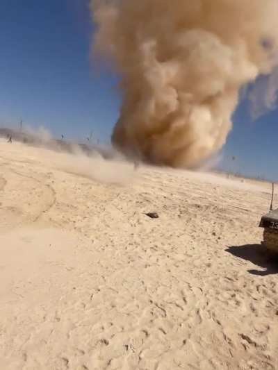 Man charges into giant dust devil
